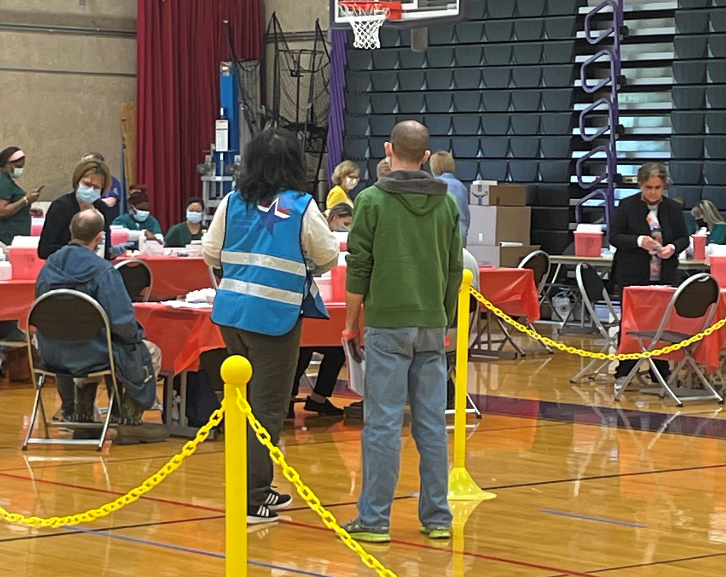 Volunteers standing in gymnasium